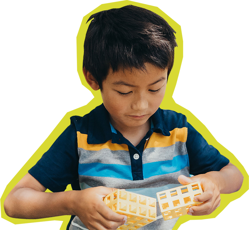 Child at SDCDM playing with blocks