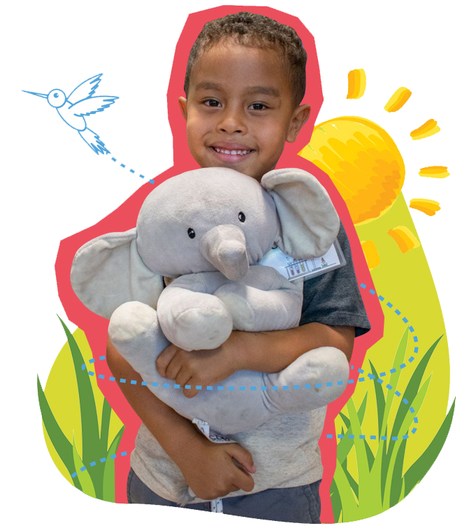 fall-camp-kid boy holding a stuffed elephant