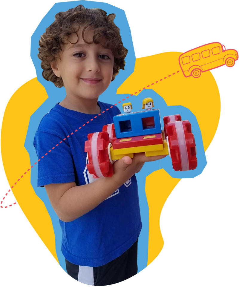 modle-car-kid kid at SDCDM holding legos and smiling at camera