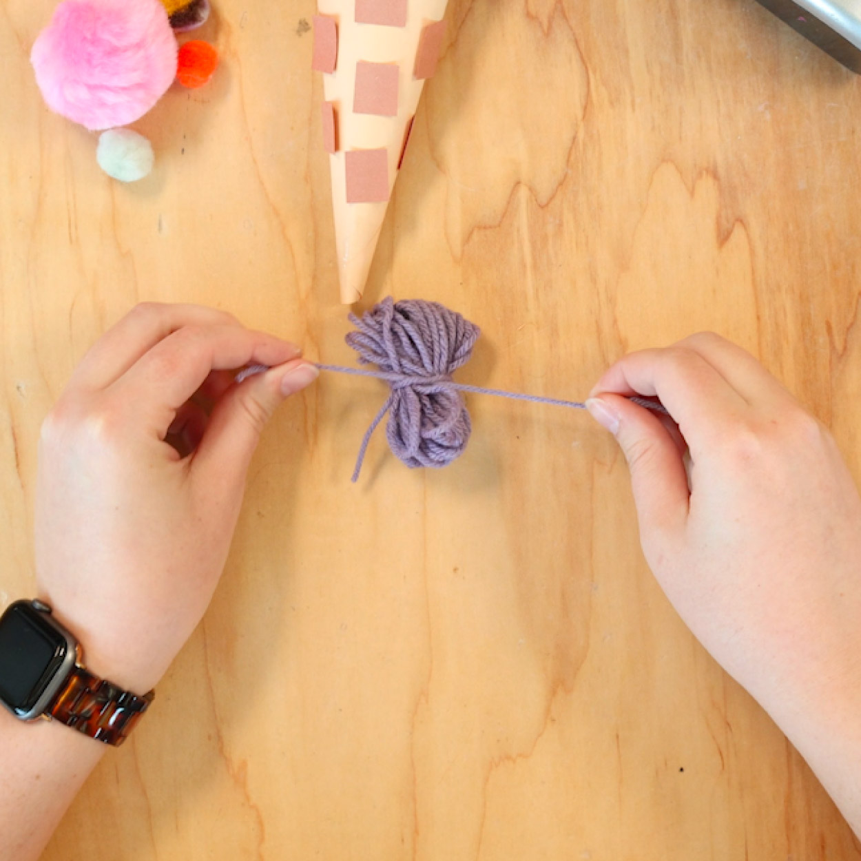 Tie string around yarn