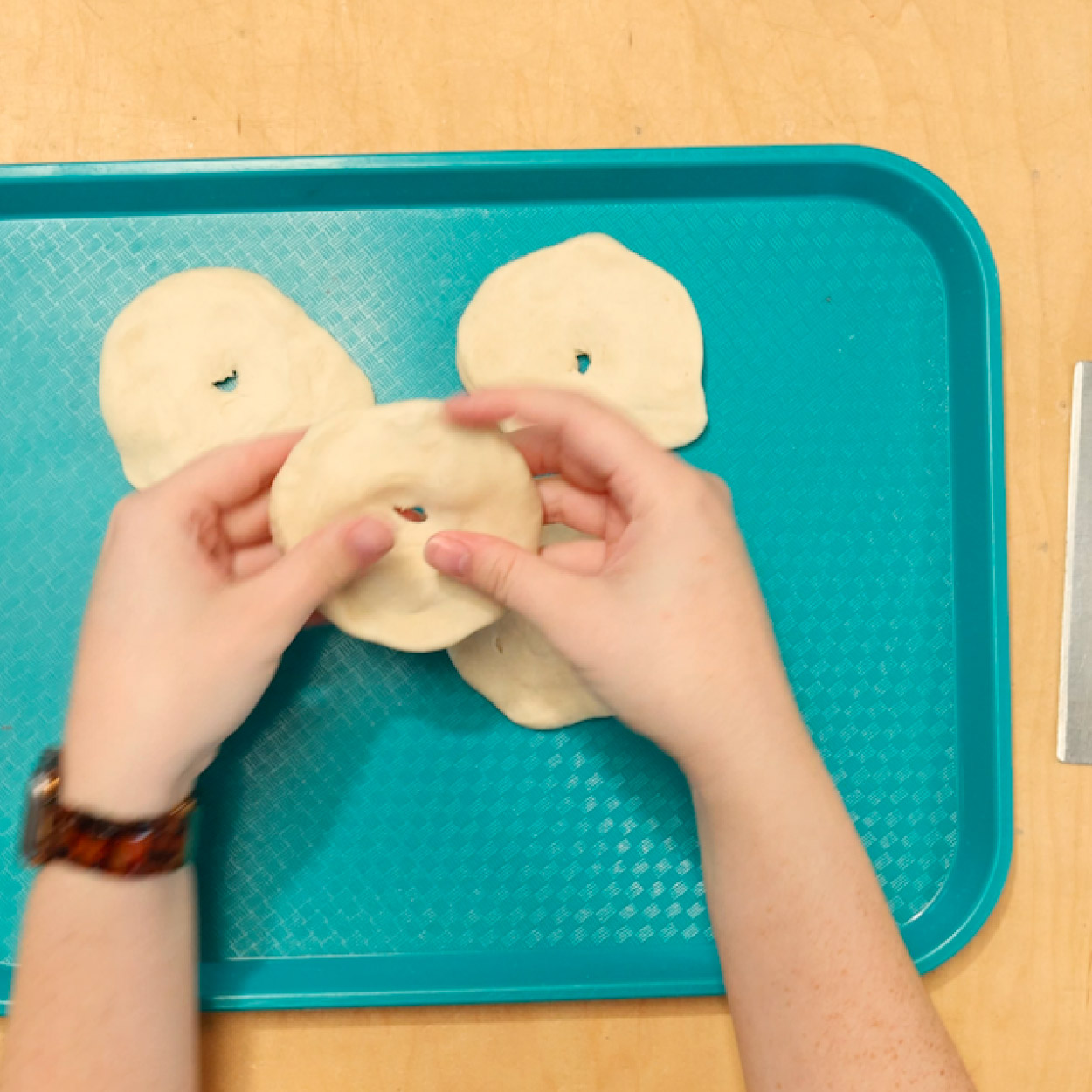 Flatten dough ball into a circle