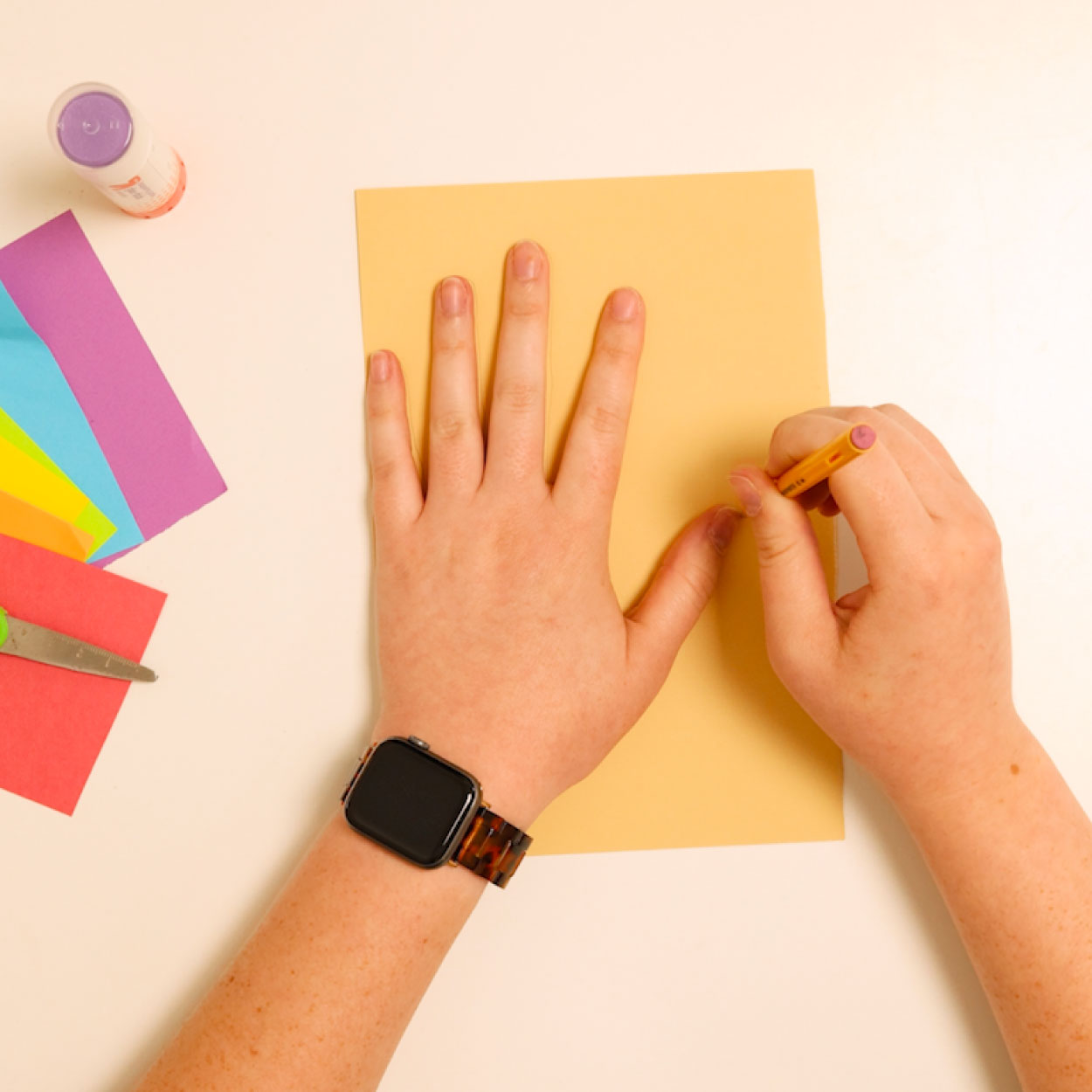 Trace hand on skin colored construction paper