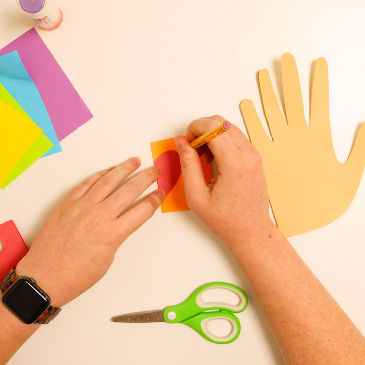 Cut out rainbow heart shapes
