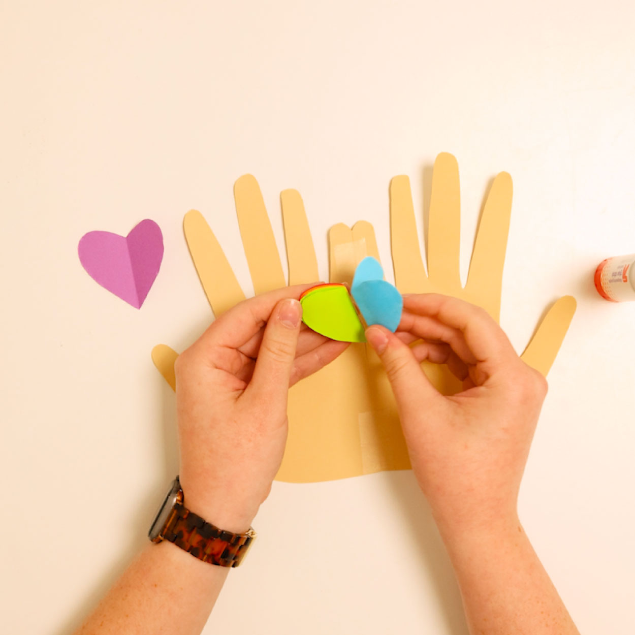 Glue the side of all 6 hearts together