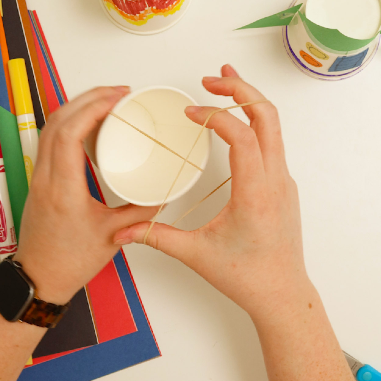 Criss-cross rubber bands on your third cup