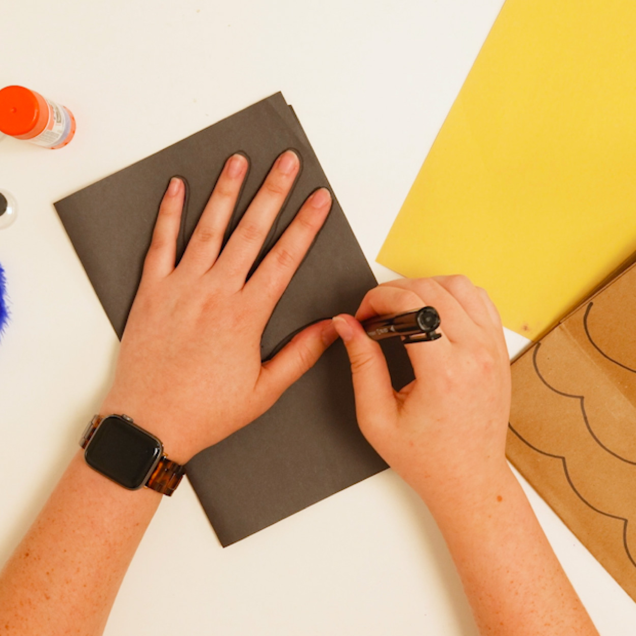 Trace your hand for the owl's wings
